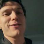 Close up of Tom Holland smiling as he talks.