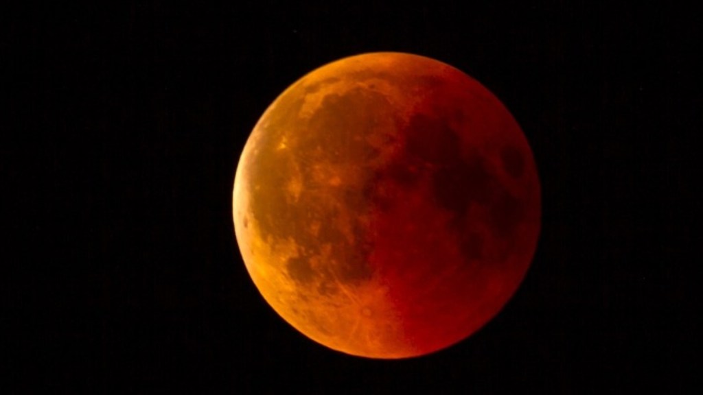 Close up of the Moon during a total lunar eclipse. This gives the Moon a reddish/orange color