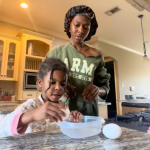 Mom patiently teaching her daughter to make egg snacks.